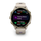 Garmin Forerunner 970 - Soft gold titanium with french grey case and french grey/translucent indigo band